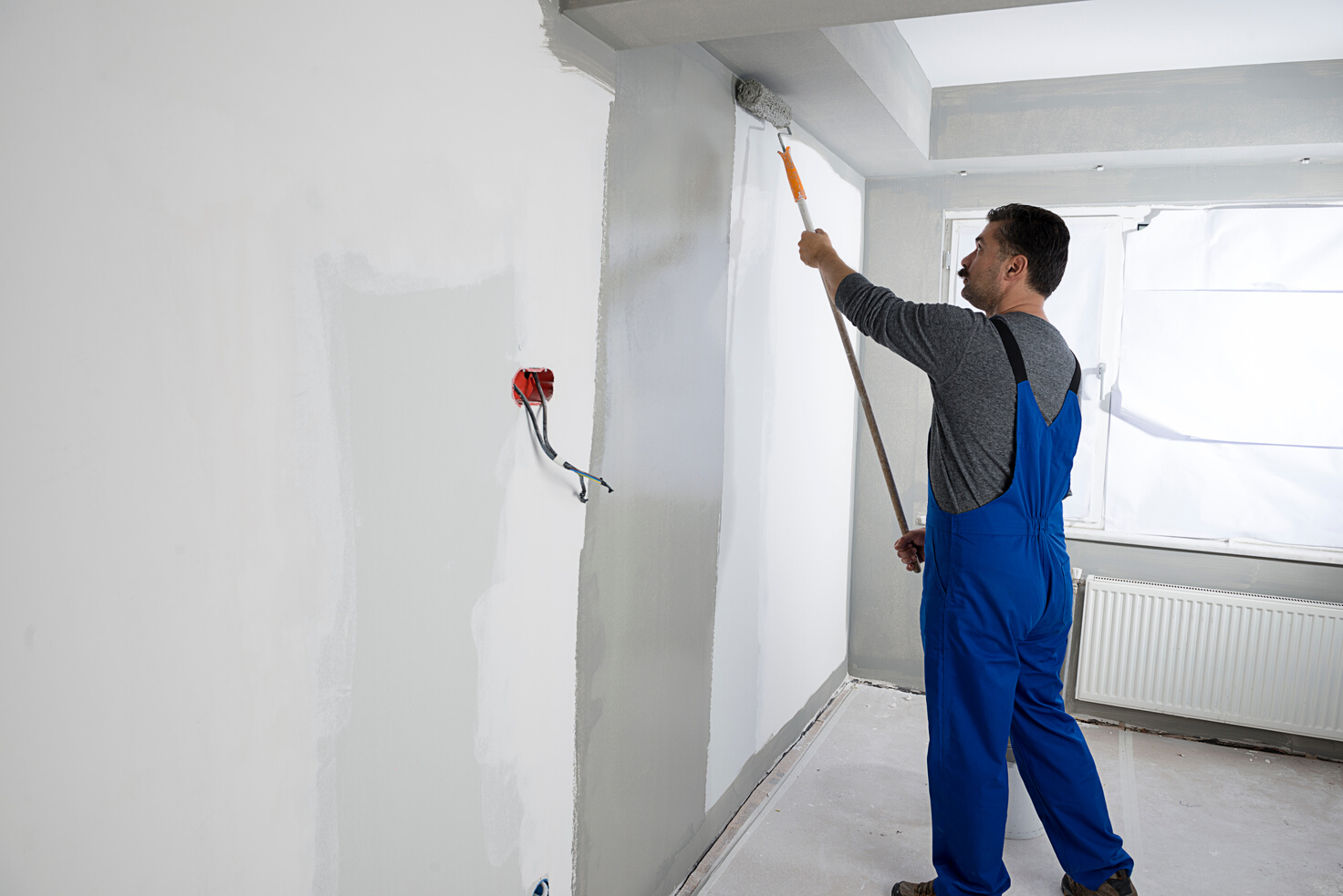 Manual Worker Painting House Interior